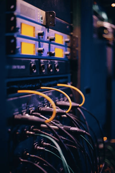 Equipment rack with yellow and black cables